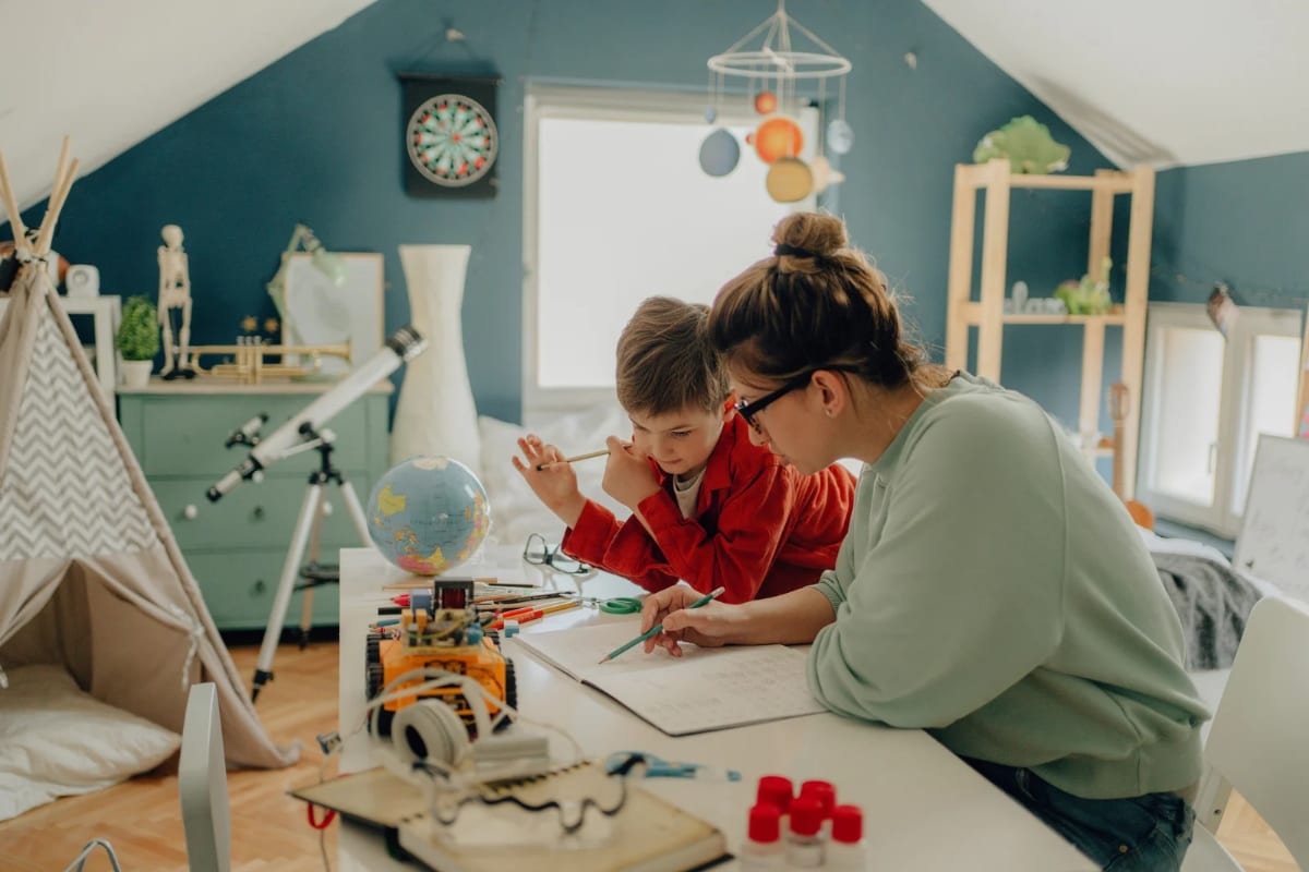 A parent and child learning together at home